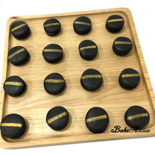 Black Macarons with gold stripe