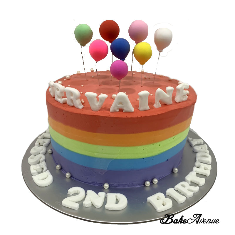 Rainbow Cake with balloon toppers