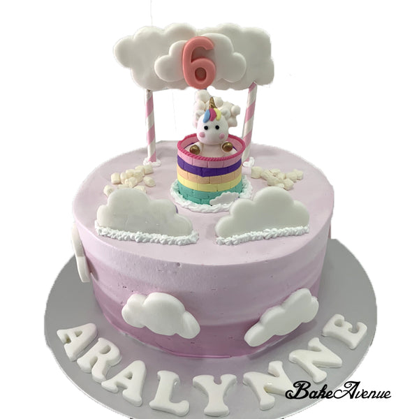 Unicorn Topper Ombre Cake with fondant decorations