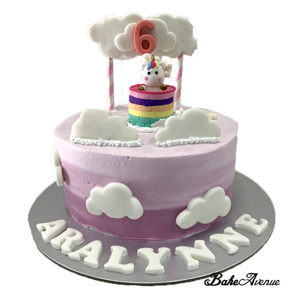Unicorn Topper Ombre Cake with fondant decorations